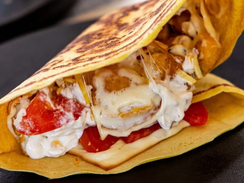A Kalokeri savoury crepe bursting with chicken, cheese and tomato
